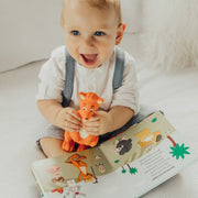 Mizzie The Kangaroo Gift Set with sound book and teething toy boy holding mizzie and book